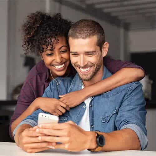 Happy couple applying for a personal loan in Australia