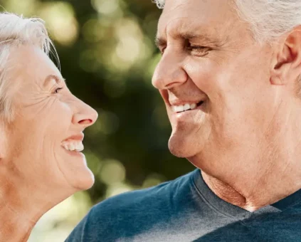 Couple Smiling after refinancing their caravan loan