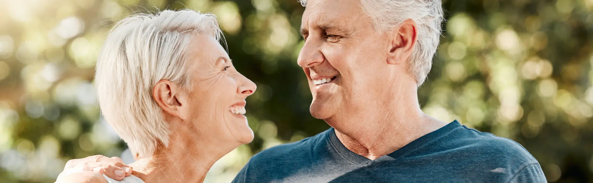 Couple Smiling after refinancing their caravan loan