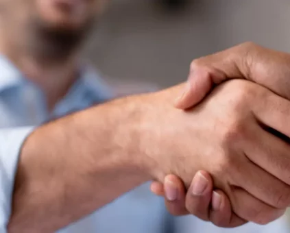Client Shaking Finance brokers hand