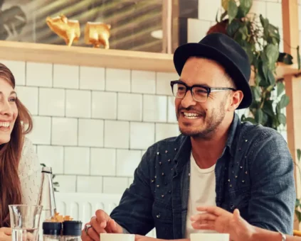 Group of business owners having happy discussion at a cafe