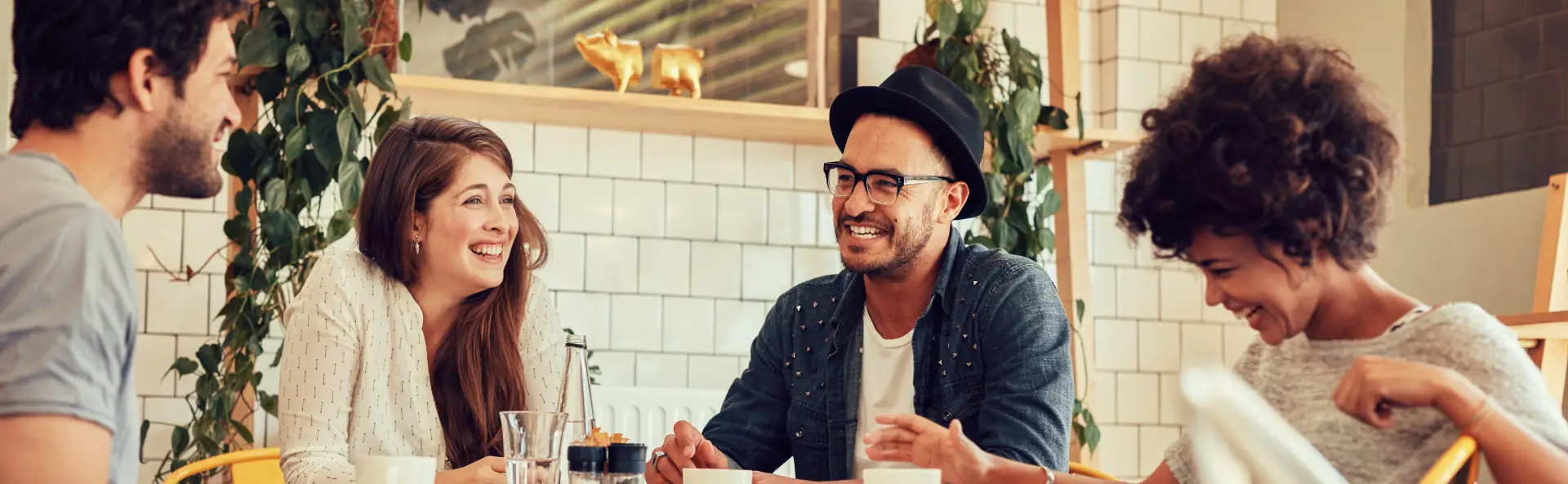 Group of business owners having happy discussion at a cafe