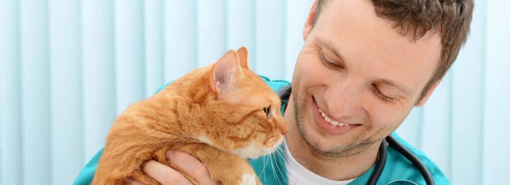 man holding a cat