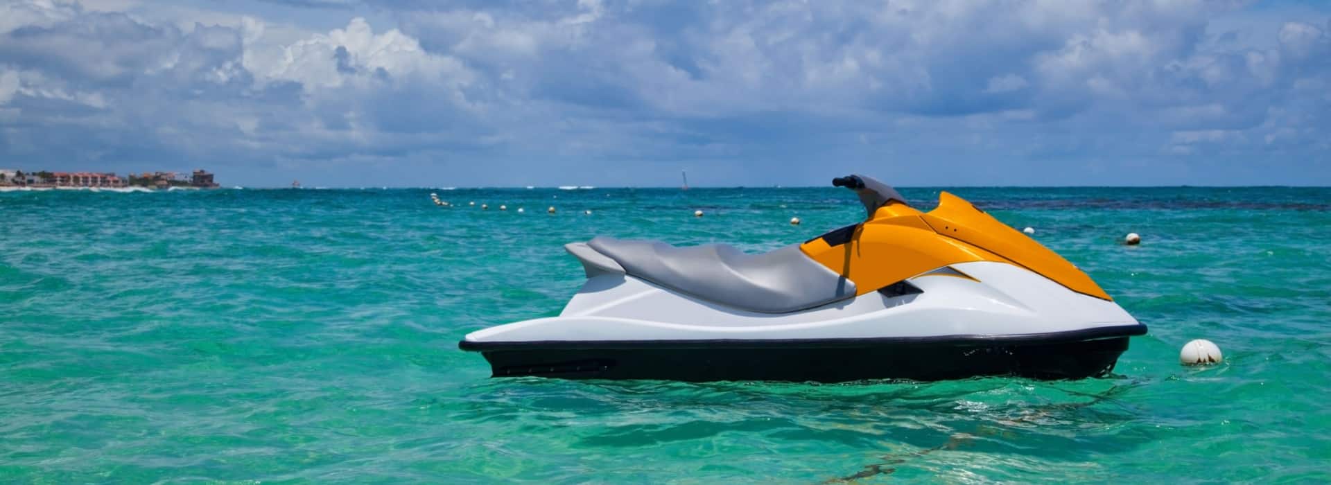 White and orange jet ski sitting in the water after getting finance for their leisure loan