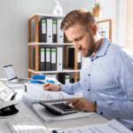 Business owner managing accounts receivable for debtor finance arrangement