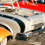 A row of vibrant classic cars with open hoods displayed at a car show, symbolizing the passion and investment behind owning vintage vehicles, highlighting classic car loan options.