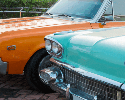 Two restored classic cars representing vehicles eligible for classic car financing