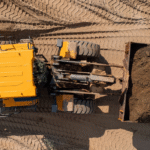 Yellow construction equipment on job site, representing business equipment financing