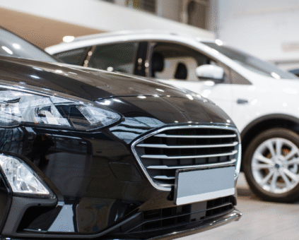 cars on display at a dealership showroom, representing car loan options