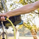 Man charging his electric vehicle