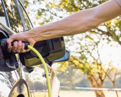 Man charging his electric vehicle
