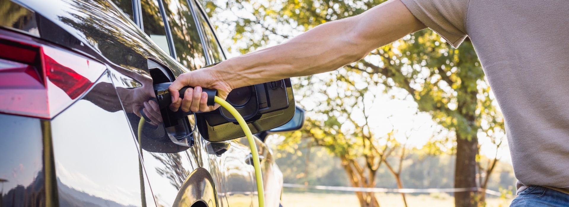 Man charging his electric vehicle
