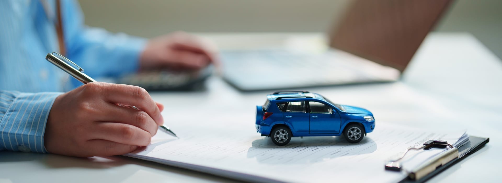 Person comparing car loan options