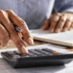 Business owner looking over bills