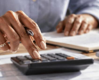 Business owner looking over bills